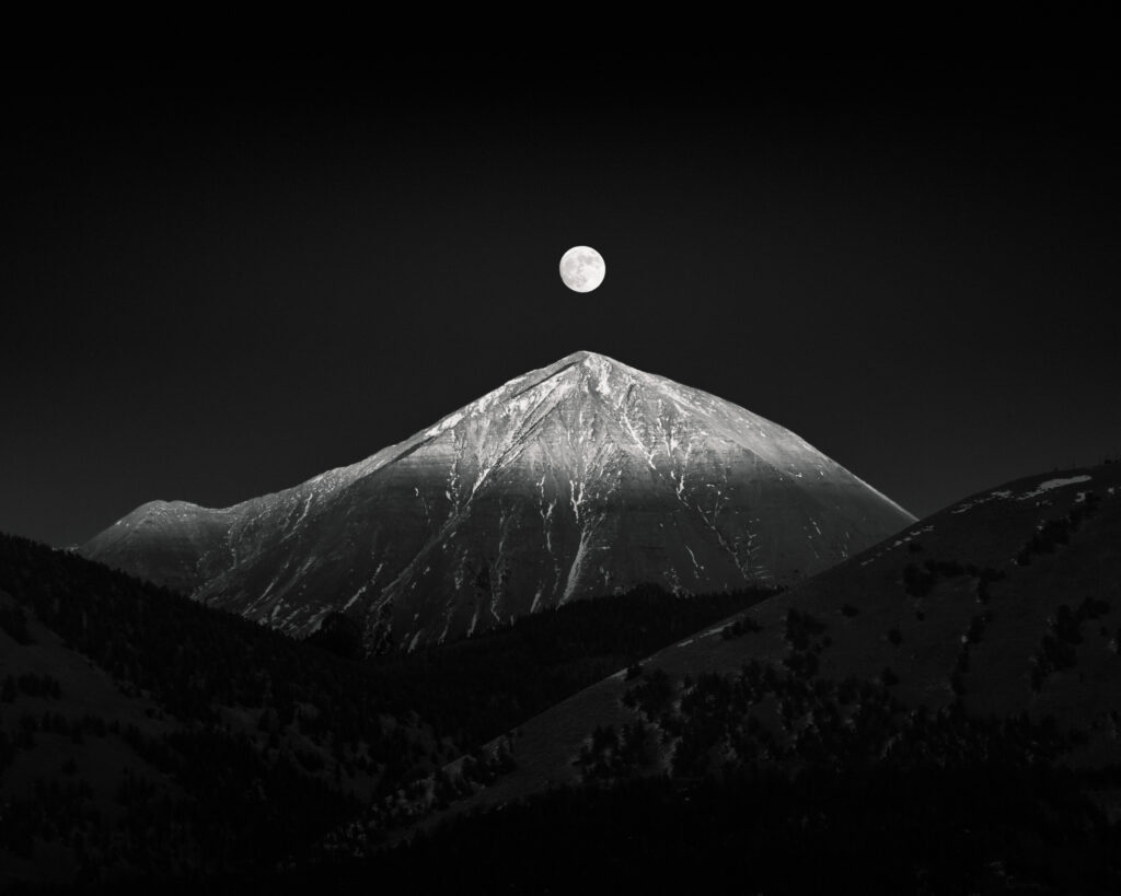 Fine art black and white landscape photograph of a moonrise over the West Spanish Peak. Processed using the BWVision B&W Artisan Pro X panel in Photoshop.